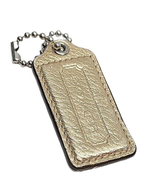 Coach Handbags - 🏷️ 2.5" Coach Metallic Gold Pebbled Leather Hangtag Bag Fob Charm Keychain Y2K